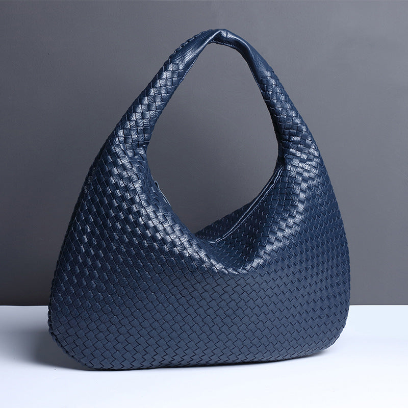 Crescent shaped hand woven fashion bag