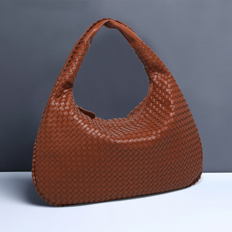 Crescent shaped hand woven fashion bag