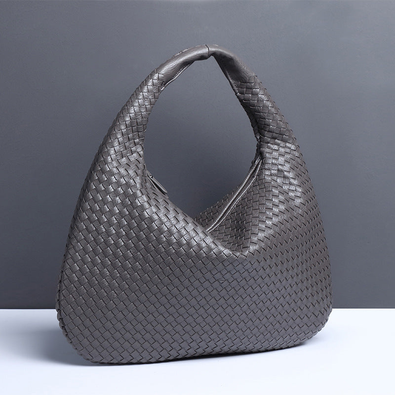 Crescent shaped hand woven fashion bag
