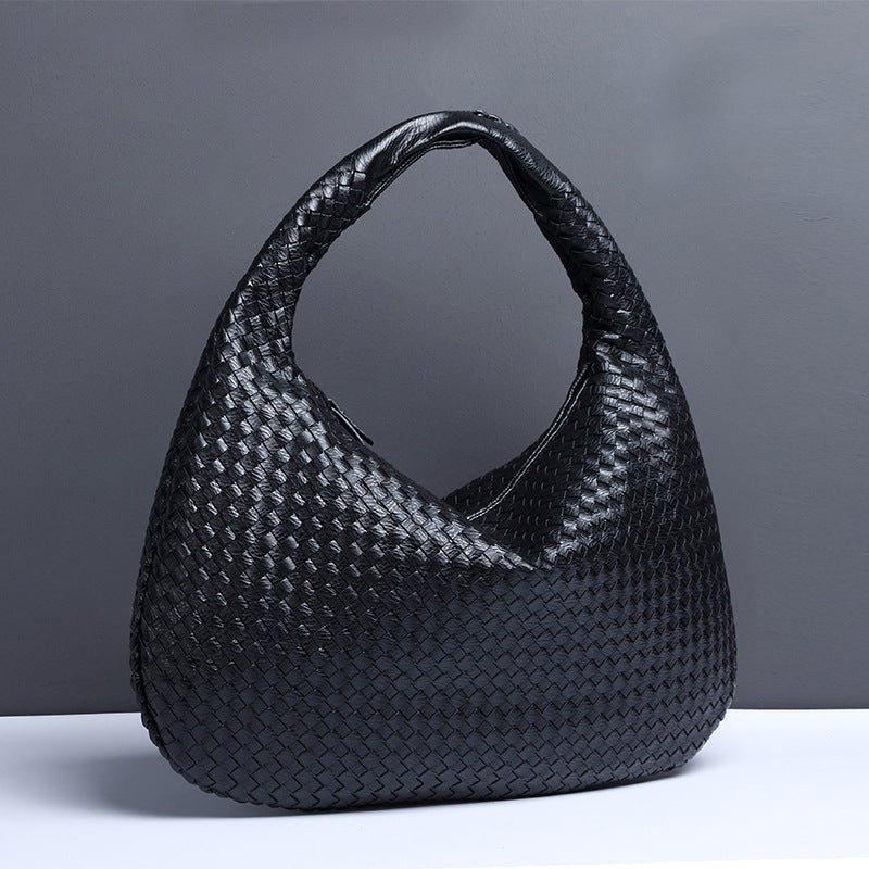 Crescent shaped hand woven fashion bag
