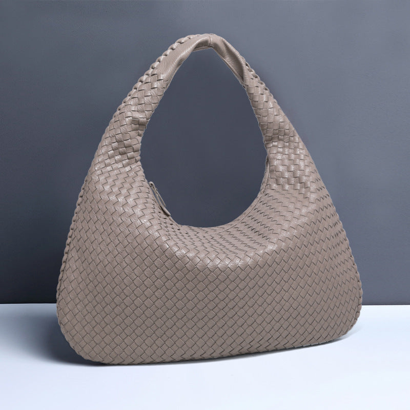 Crescent shaped hand woven fashion bag